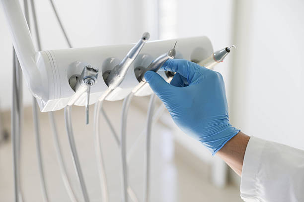 Professional Tooth Extraction technician working in Pecan Grove, TX